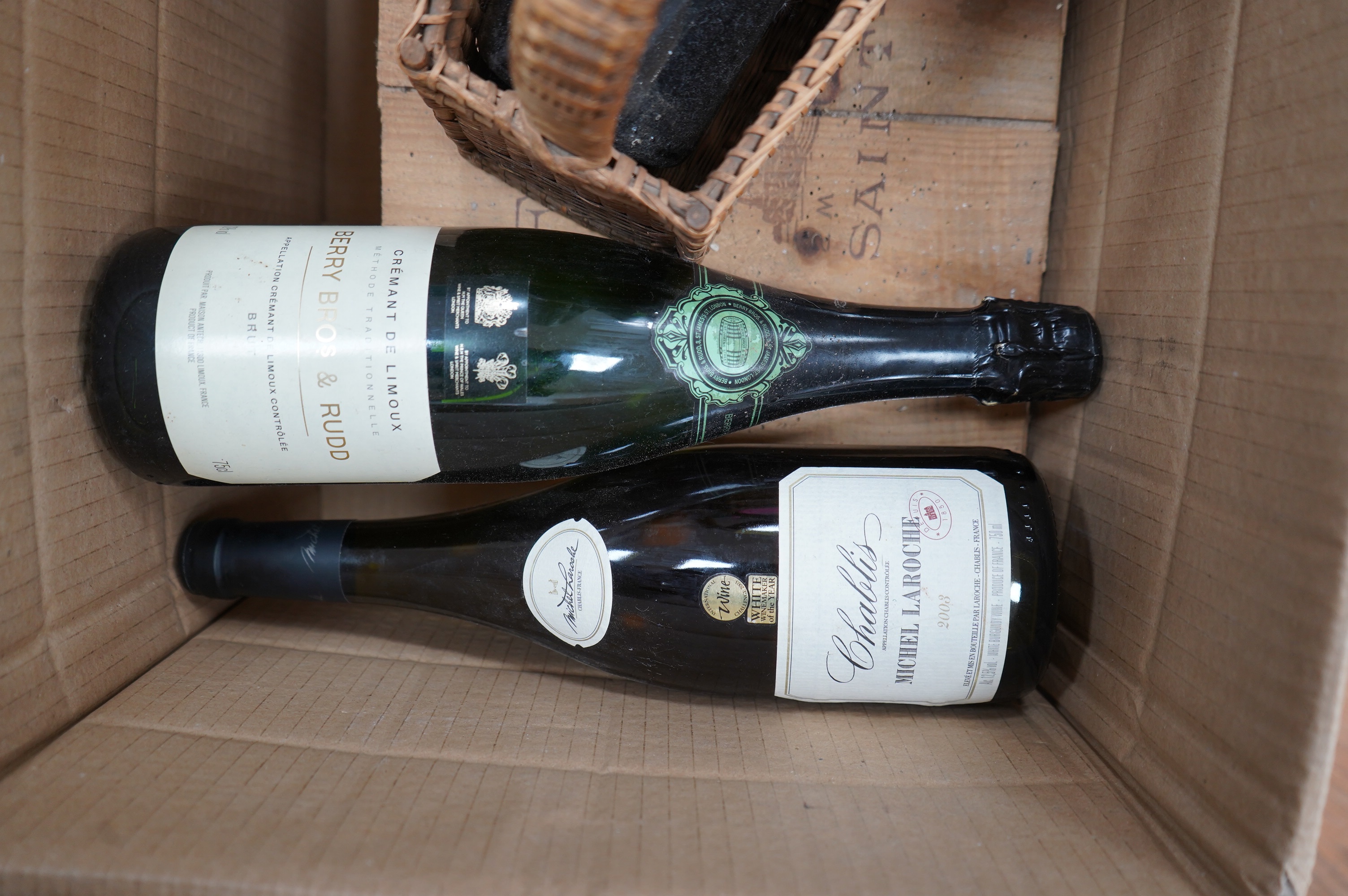 Two large bottles of Chateau Fombrange in wooden crate and three other bottles. Condition - fair, storage unknown